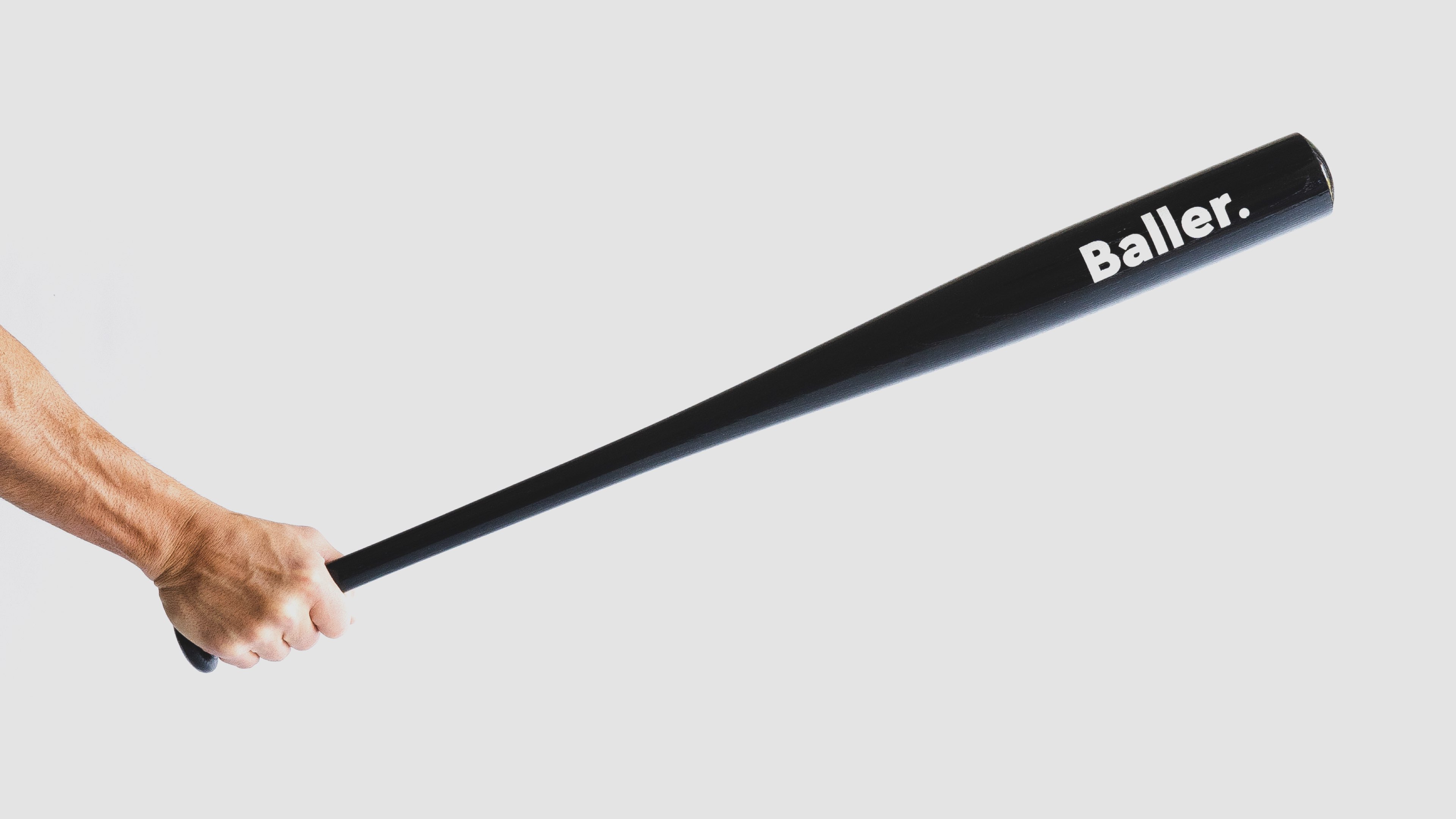 Person holding the Rareview custom Baller bat